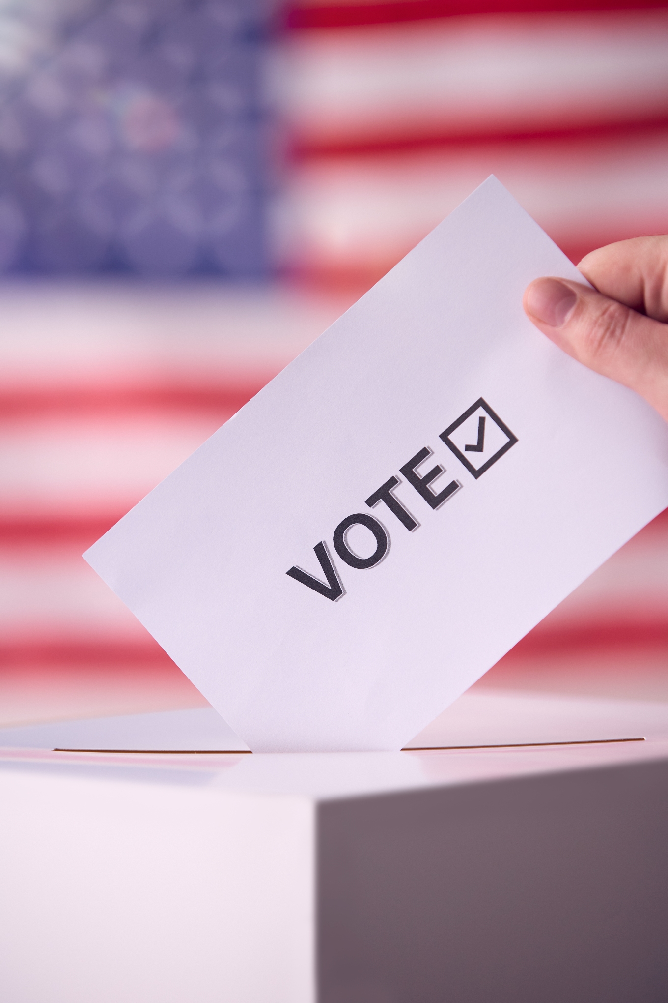 Ballot Being Cast in Front of American Flag
